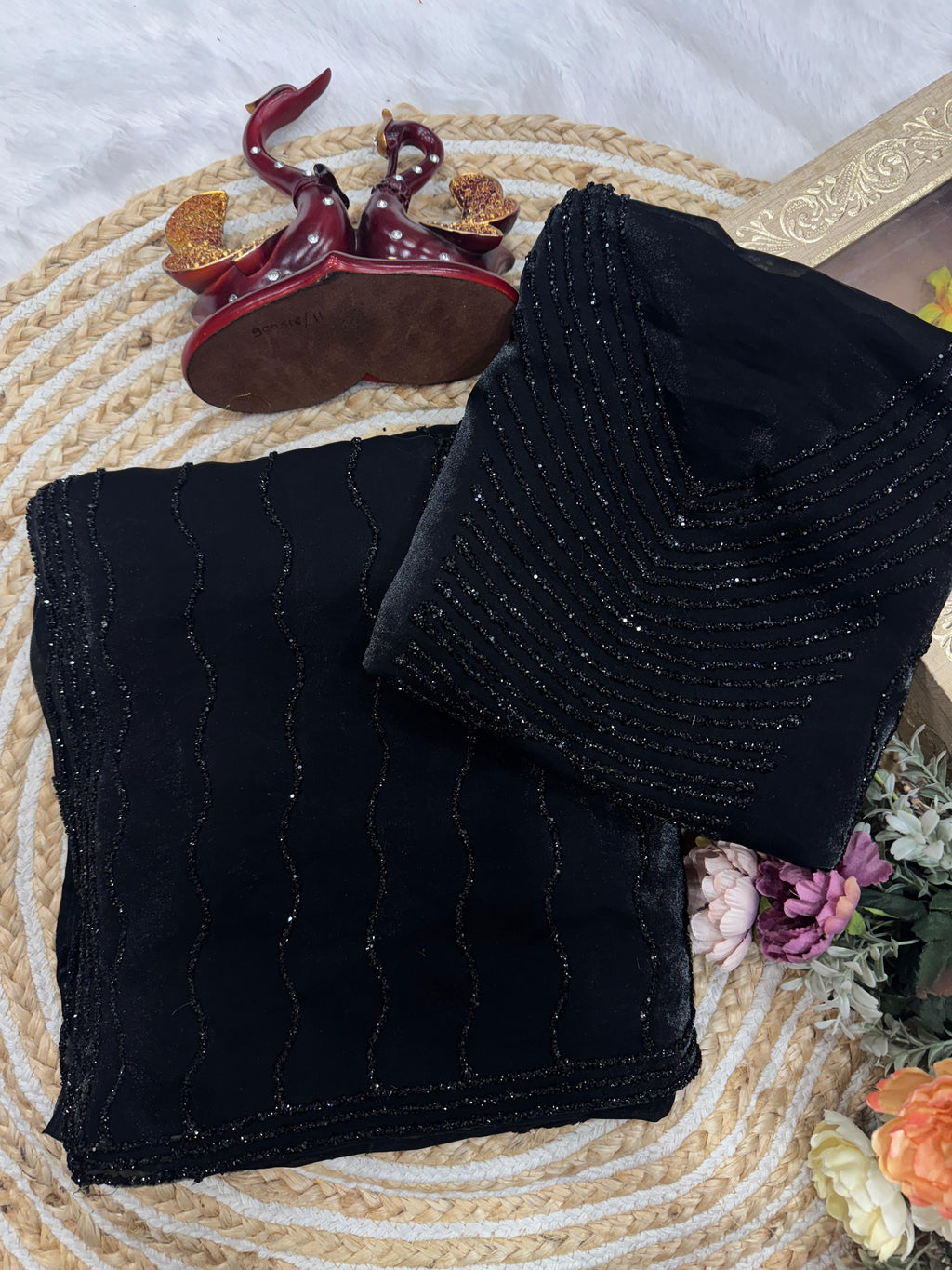 Black diamond work bring out the vibrancy of this black space silk saree.