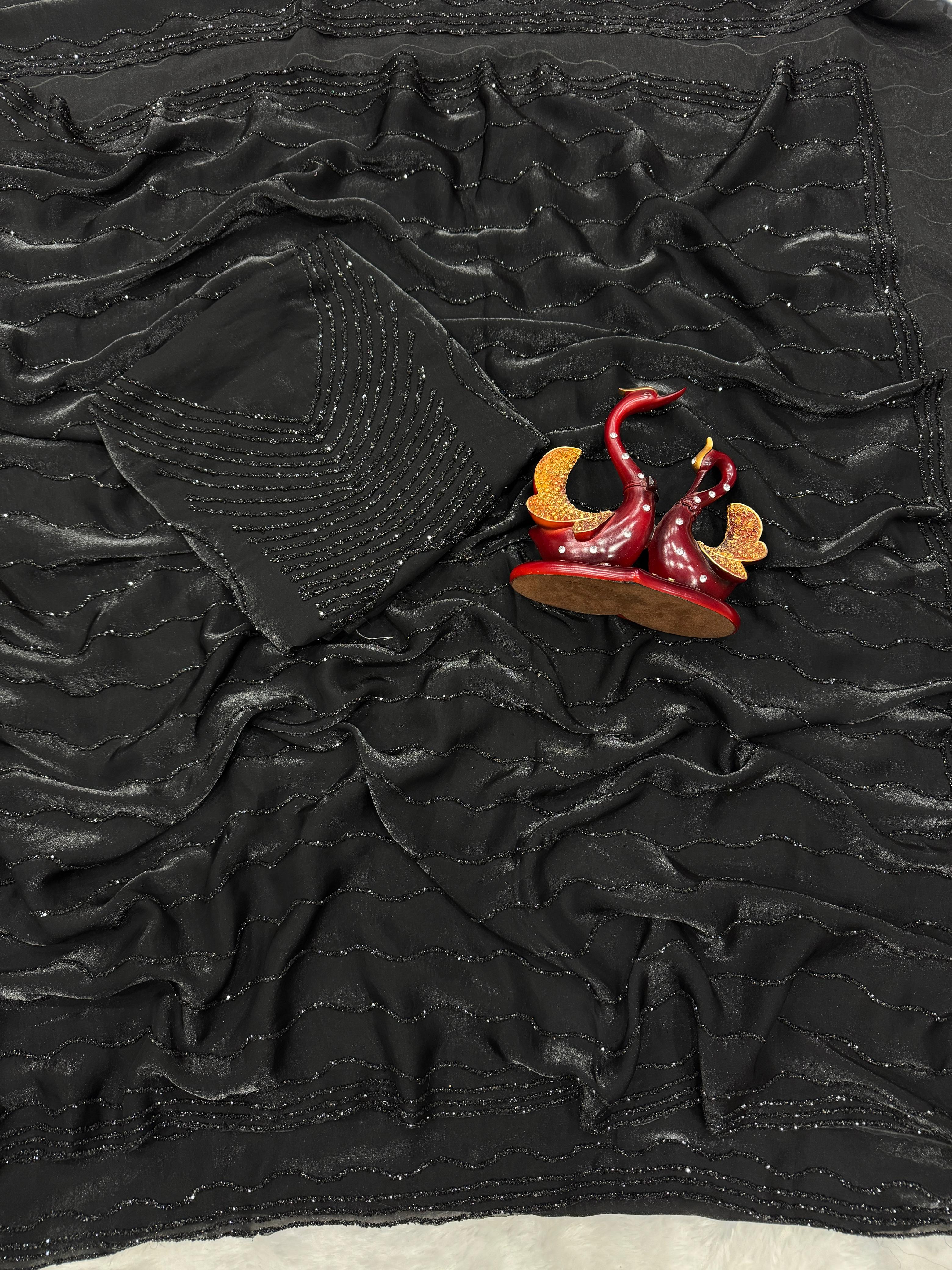 Black diamond work bring out the vibrancy of this black space silk saree.