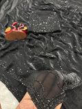 Black diamond work bring out the vibrancy of this black space silk saree.